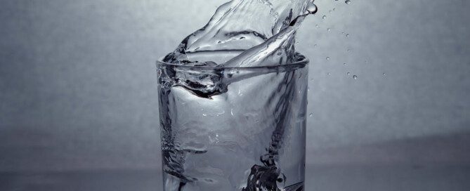 Water splashing out of glass